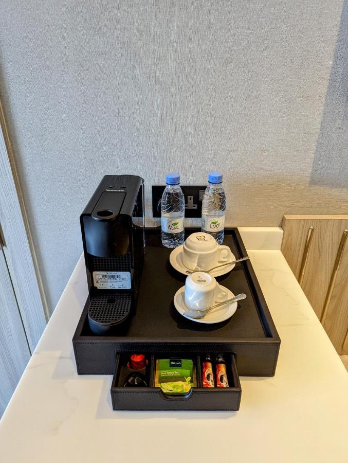 Citadines Abha Aparthotel Exterior photo A Nespresso coffee machine in a hotel room